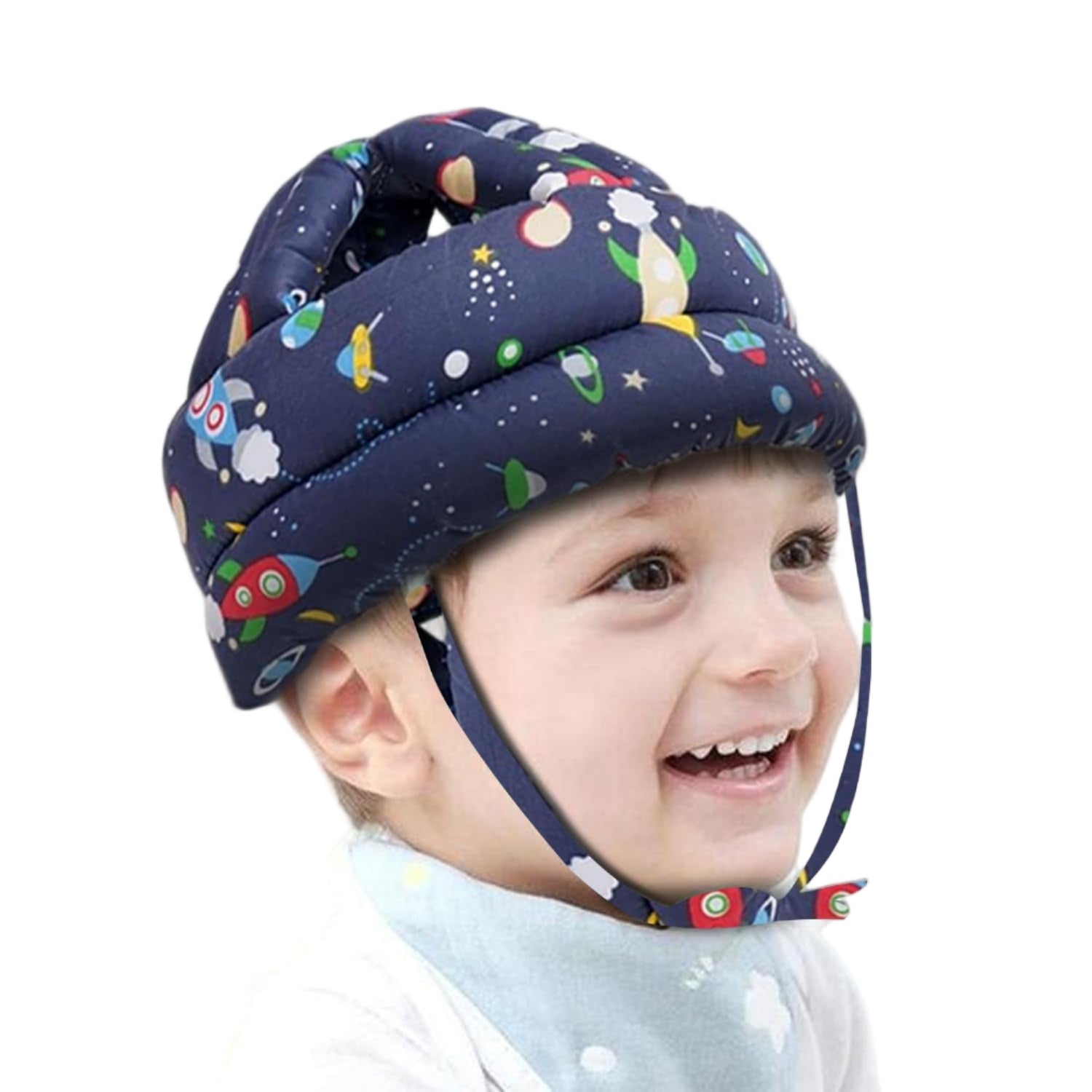 Child wearing a colorful space-themed helmet for safety on a white background